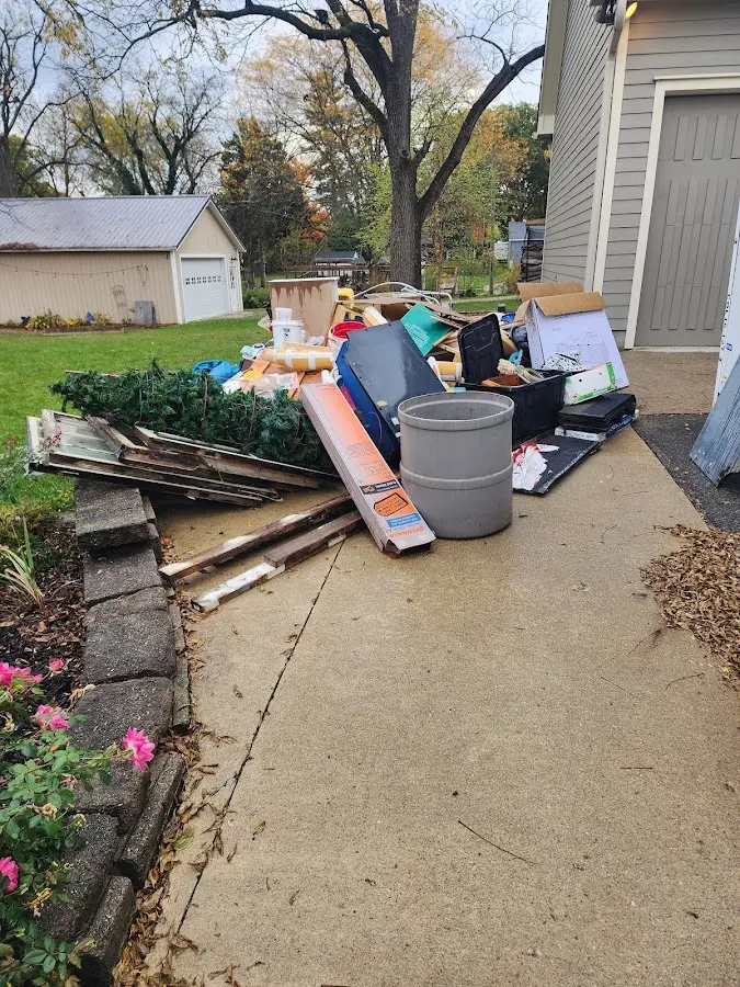 Dumpster being loaded with debris for Demolition Dumpster Rental in West Newbury